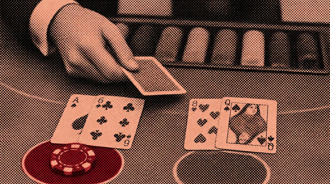 Rasterbillede af et blackjackbord hvor kort deles ud